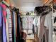Fully stocked walk-in closet with lots of storage space for clothes and other items at 1432 Windjammer Pl, Valrico, FL 33594