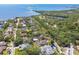 Wide aerial shot of a neighborhood near the water, showing the surrounding landscape at 1709 Sunset Dr, Tarpon Springs, FL 34689
