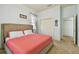 Comfortable bedroom featuring a plush bed, spacious closet, and soft natural lighting at 1709 Sunset Dr, Tarpon Springs, FL 34689