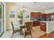 Dining area has a glass-top table, wicker chairs, and sliding doors leading outside at 1709 Sunset Dr, Tarpon Springs, FL 34689