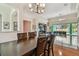 Open-concept dining room with views to the backyard at 1709 Sunset Dr, Tarpon Springs, FL 34689