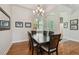 Dining area featuring a chandelier and a large window view at 1709 Sunset Dr, Tarpon Springs, FL 34689