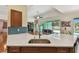 Kitchen island featuring a sink and plenty of counterspace at 1709 Sunset Dr, Tarpon Springs, FL 34689