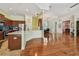 Open kitchen with stainless steel appliances and tiled backsplash overlooks the dining and living areas at 1709 Sunset Dr, Tarpon Springs, FL 34689