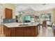 Kitchen with a large island and views to the back patio at 1709 Sunset Dr, Tarpon Springs, FL 34689