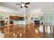 Expansive living room with hardwood floors, open layout to the kitchen, and natural light at 1709 Sunset Dr, Tarpon Springs, FL 34689