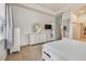 Bright main bedroom with a plush bed, neutral colored walls, and open layout to the bath area at 1709 Sunset Dr, Tarpon Springs, FL 34689