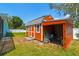 A versatile storage shed provides a convenient solution for organizing tools and equipment in the backyard at 1709 Sunset Dr, Tarpon Springs, FL 34689