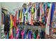 Walk-in closet features ample storage, hanging racks, and dedicated space for shoes and accessories at 1709 Sunset Dr, Tarpon Springs, FL 34689