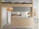 Bright kitchen with updated appliances and a breakfast bar overlooking the dining area at 18514 Hidden Pines Way, Hudson, FL 34667