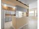Charming kitchen with updated appliances and a breakfast bar overlooking the dining area at 18514 Hidden Pines Way, Hudson, FL 34667