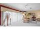 Bright living room with large windows, neutral tones, and tasteful decor at 18514 Hidden Pines Way, Hudson, FL 34667