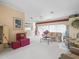 Open concept living room features bright and airy ambiance, plush seating and a seamless flow at 18514 Hidden Pines Way, Hudson, FL 34667