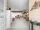 Bright living room with neutral color palette, plush seating, and lots of natural light at 18514 Hidden Pines Way, Hudson, FL 34667