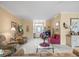 Spacious living room with ample seating, stylish decor, and a clear view of the entry at 18514 Hidden Pines Way, Hudson, FL 34667