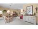 Spacious living room with comfortable seating, decorative art and luxury interior design at 18514 Hidden Pines Way, Hudson, FL 34667