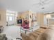 Well-lit living room with an open layout, stylish decor, and a welcoming atmosphere at 18514 Hidden Pines Way, Hudson, FL 34667