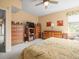 Spacious bedroom featuring neutral carpet, dresser and natural light at 18514 Hidden Pines Way, Hudson, FL 34667