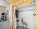 Accessible tile shower with seat, grab bar, and patterned curtain at 18514 Hidden Pines Way, Hudson, FL 34667