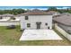 Backyard view showing the patio, trampoline, and fenced yard, offering great outdoor living at 1876 Colding Dr, Ruskin, FL 33570