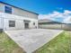 Spacious backyard featuring a concrete patio, ideal for outdoor gatherings and relaxation at 1876 Colding Dr, Ruskin, FL 33570