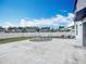 Concrete backyard with trampoline and white fence, perfect for outdoor entertainment and play at 1876 Colding Dr, Ruskin, FL 33570