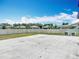 Large concrete backyard with white fence, providing ample space for outdoor activities and privacy at 1876 Colding Dr, Ruskin, FL 33570