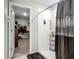 Bathroom shower featuring a shower curtain and an adjacent walk in closet at 1876 Colding Dr, Ruskin, FL 33570