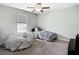 Bedroom featuring carpeting, natural lighting and two beds at 1876 Colding Dr, Ruskin, FL 33570
