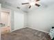 Bedroom featuring carpeted floors, neutral walls and a closet for storage at 1876 Colding Dr, Ruskin, FL 33570