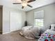 Cozy bedroom featuring a large window, carpeting and ample natural light at 1876 Colding Dr, Ruskin, FL 33570