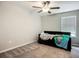 Carpeted bedroom with ceiling fan, natural lighting and a comfortable layout at 1876 Colding Dr, Ruskin, FL 33570