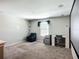 Upstairs bonus room with carpeting and a wall mounted movie screen at 1876 Colding Dr, Ruskin, FL 33570