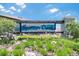 Inviting community sign for Spencer Creek, surrounded by beautiful landscaping and vibrant flowers at 1876 Colding Dr, Ruskin, FL 33570