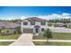 Charming two-story home features an attached two-car garage, and manicured landscaping at 1876 Colding Dr, Ruskin, FL 33570