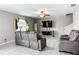 Comfortable living room with modern decor, tile floors, and ample natural light at 1876 Colding Dr, Ruskin, FL 33570
