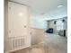 Cozy upstairs loft featuring plush carpeting, a mini-fridge and a comfortable seating area at 1876 Colding Dr, Ruskin, FL 33570