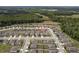 An aerial view of the community shows the layout of homes and surrounding landscape at 19041 Alfaro Loop, Spring Hill, FL 34610