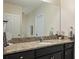 Granite vanity with sink and mirror; well-lit and functional for daily routines at 19041 Alfaro Loop, Spring Hill, FL 34610