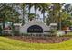 Talavera community sign with stone accents, landscaping, and palm trees provides a warm welcome at 19041 Alfaro Loop, Spring Hill, FL 34610