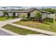 Charming single-story home boasts a manicured lawn, inviting curb appeal, and an attached two-car garage at 19041 Alfaro Loop, Spring Hill, FL 34610