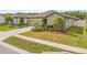 Charming single-story home boasts a well-manicured lawn, tasteful landscaping, and a welcoming front entrance at 19041 Alfaro Loop, Spring Hill, FL 34610