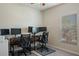 A dedicated home office space with dual workstations, multiple monitors, and comfortable chairs at 19041 Alfaro Loop, Spring Hill, FL 34610