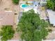 Aerial view of backyard with a pool and hot tub in a fenced yard at 202 Cranberry Ln, Brandon, FL 33510