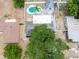 Aerial view of backyard with a pool and hot tub in a fenced yard at 202 Cranberry Ln, Brandon, FL 33510