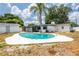 Backyard pool with landscaping, patio and detached garage in the background at 202 Cranberry Ln, Brandon, FL 33510