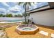 This backyard features a swimming pool and hot tub with a partially shaded area at 202 Cranberry Ln, Brandon, FL 33510