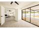 View from bedroom through a doorway to a living area and pool and patio beyond a sliding glass door at 202 Cranberry Ln, Brandon, FL 33510