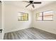 Clean bedroom with a ceiling fan, natural lighting, and new flooring at 202 Cranberry Ln, Brandon, FL 33510