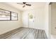 Light filled bedroom with a ceiling fan, new flooring and back exterior door at 202 Cranberry Ln, Brandon, FL 33510